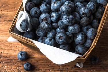 Fresh Blueberries in Wood Pint Basket on wooden table
