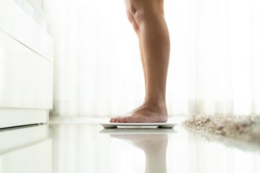 How Much Weight Would I Have to Lose to Go Down a Dress Size?, Livestrong.com