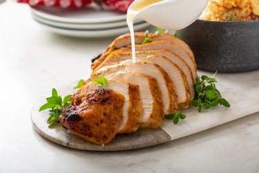 Roast turkey breast cooked in a convection oven sliced on a plate for holidays