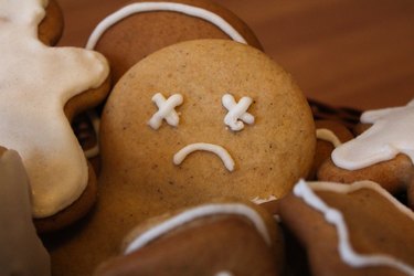 close view of a sad gingerbread man cookie, to represent the holiday blues