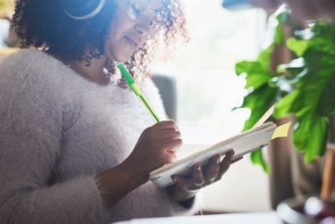 woman writing in a journal