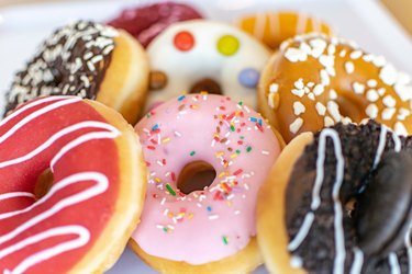 Tasty donuts on a white tray close up