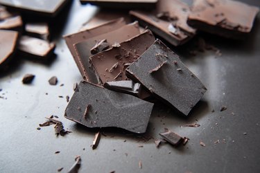 close up photo of cracked pieces of dark chocolate
