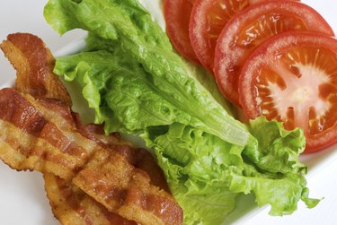 BLT ingredients on a white plate.