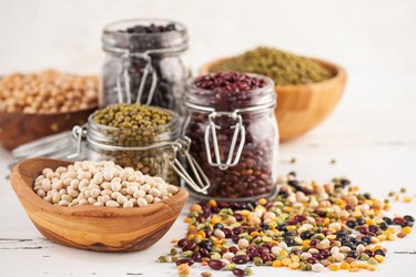 Assortment of dry organic beans and lentils in glass jar