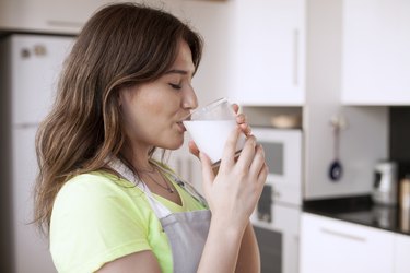 young woman drinking milk