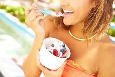 Young African American Woman Enjoying Frozen Yogurt