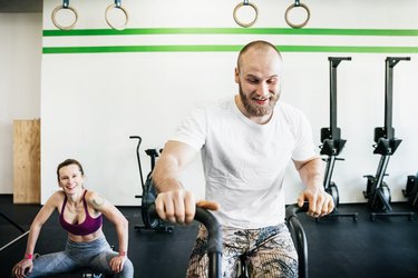 Man Using exercising Using Seated Elliptical