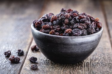 pot of brazilian raisin, candied fruit used in sweets, inside a handmade clay pot