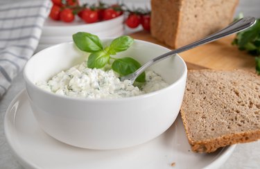 marinated cottage cheese salad with herbs and olive oil served with rye bread