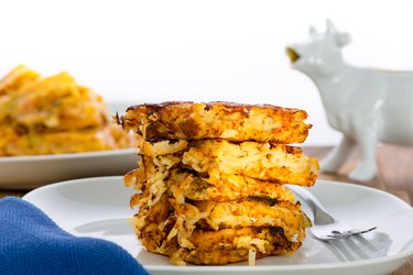 Stack of crispy waffle hash browns on a plate
