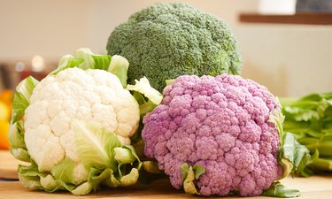 Cruciferous vegetables, some of the most sulfur rich vegetables, on a cutting board