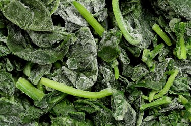 Unthawed block of frozen spinach.