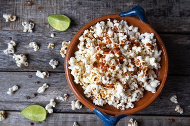 getting seasoning to stick to popcorn in a bowl using hot sauce and lime juice