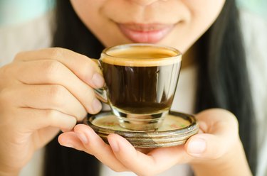 Person Holding hot Espresso made from the best espresso beans