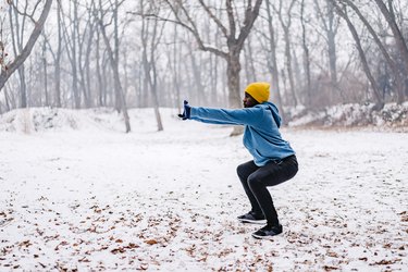 Person doing exercises to prepare for skiing or ice skating