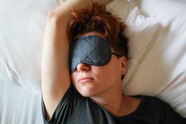 Woman Sleeping in bed, as a natural remedy for night sweats