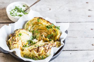 inositol-rich cabbage and cutted cabbage on wooden