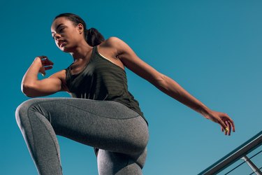 Athlete moving synovial joints and fluid in bony articulations of knees and elbows during exercise.