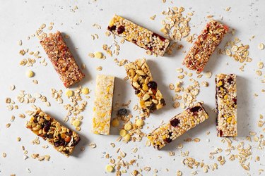 Nuts and oats protein bars on white background