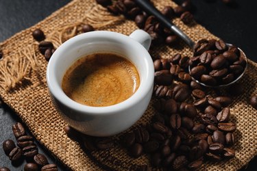 Espresso served in cup on dark