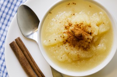 Applesauce with cinnamon in a white bowl from above