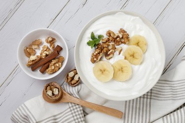 Yogurt breakfast with banana and walnuts