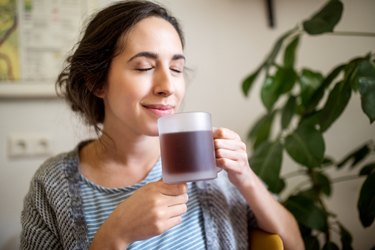 person with IBS having coffee in morning at home