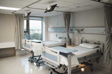 Healthcare, insurance and medical hospital bed interior or ward room for insurance, health care or clinic background. Covid 19, disease and specialized treatment center for ill, sick or recovery