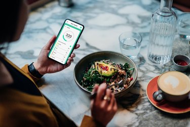 person Using Meal Planning Mobile App for a Healthy Diet