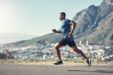 Person in workout clothes running outside after an ankle sprain.