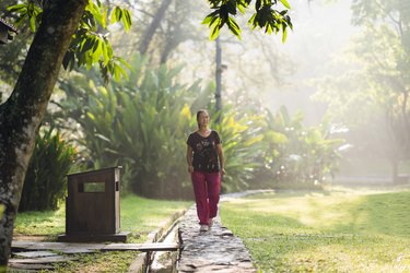 woman walking outside on path in park