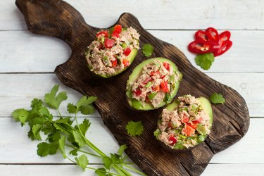 Avocados stuffed with canned tuna and vegetables