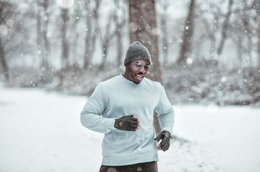 Young man exercising in the forest