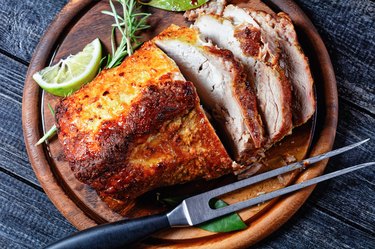 Bone-in Pork Sirloin Roast recipe of carved tenderloin roast on wooden cutting board