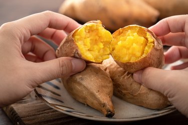 Homemade delicious roasted sweet potato in a plate for eating.