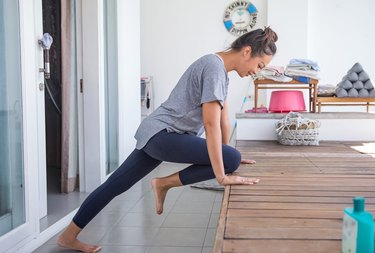 Woman doing elevated mountain climber exercise at home