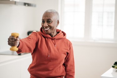 A woman doing exercise after a heart attack at home