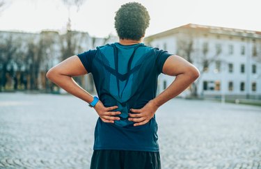 Man with back pain during a workout