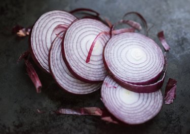 Sliced Purple Onion on a Concrete Countertop