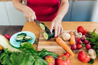 Woman preparing low-fiber vegetables.