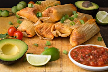 Tamales And Salsa on a wooden table