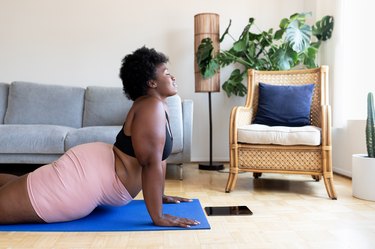 Woman doing yoga exercise at home, as a natural remedy for insomnia