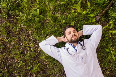 Young doctor meditating in nature for brain health