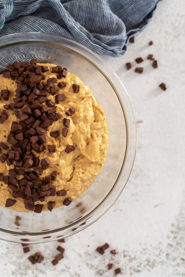 chocolate chip cookies dough in a glass bowl