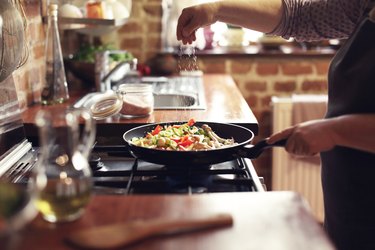Cooking vegetables in a pan for the blue zones diet meal plan