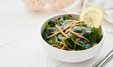 close up image of iodine-rich kelp salad in a white bowl