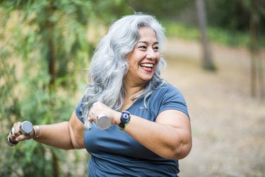 mature woman with COPD exercising with light weights