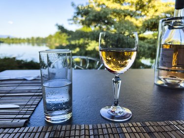 Close-up of pink wine and a glass of water.