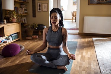 woman doing yoga, as a natural remedy for vertigo